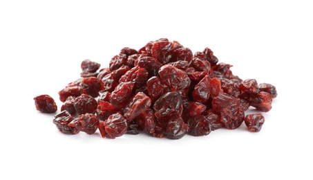 Photo of Pile of tasty dried cranberries isolated on white