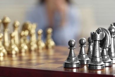 Photo of Chess board with silver pieces, closeup. Space for text