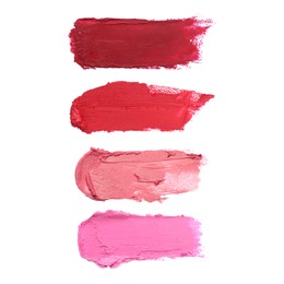 Image of Smears of different beautiful lipsticks on white background, top view