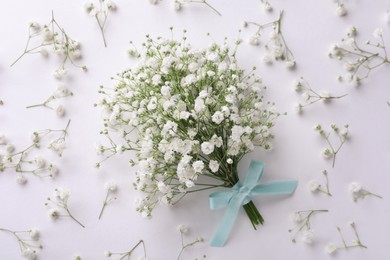 Photo of Beautiful bouquet of gypsophila flowers on white background, flat lay