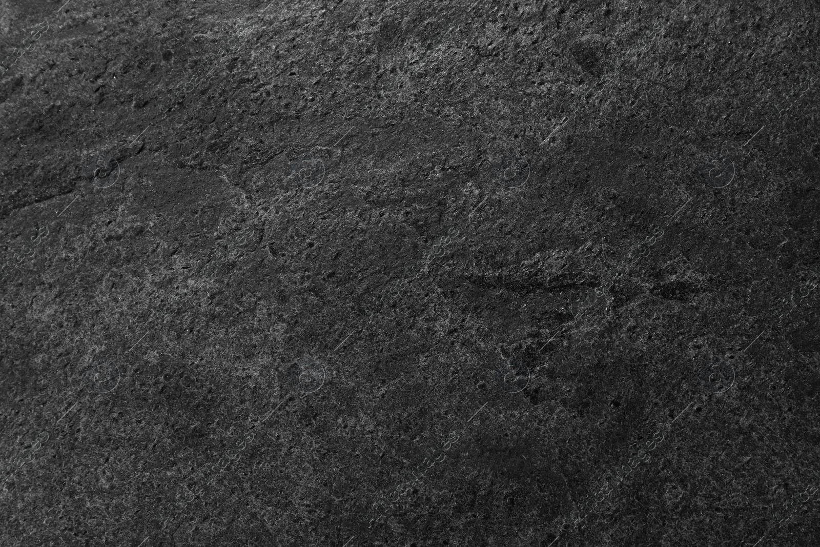 Image of Texture of dark grey stone surface as background, closeup