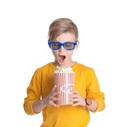 Photo of Cute boy in 3D glasses with popcorn bucket isolated on white