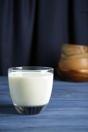 Photo of Glass of hemp milk on wooden table