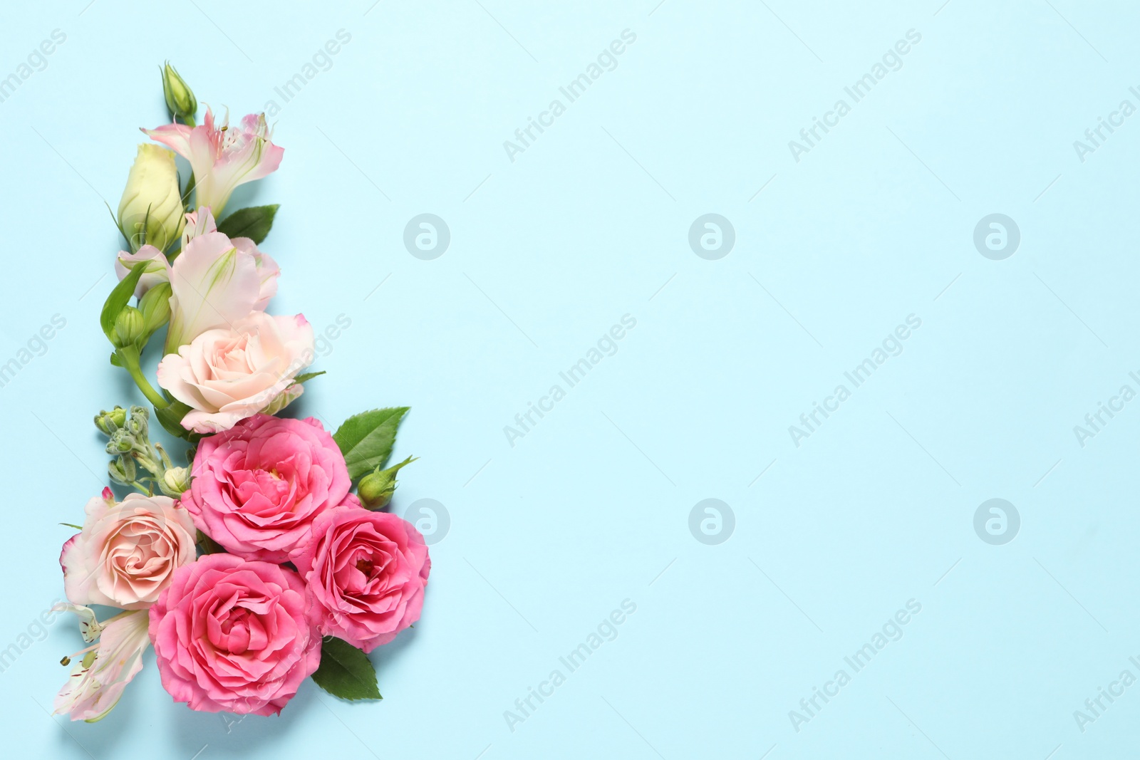 Photo of Happy Mother's Day. Beautiful flowers on light blue background, flat lay. Space for text