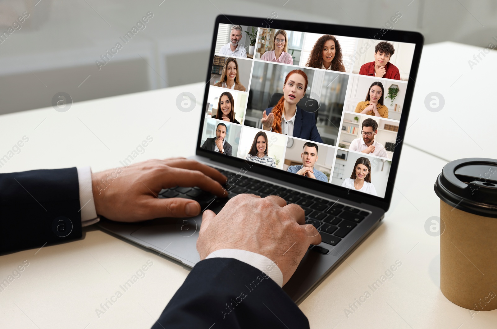 Image of Man participating in webinar via laptop at table, closeup