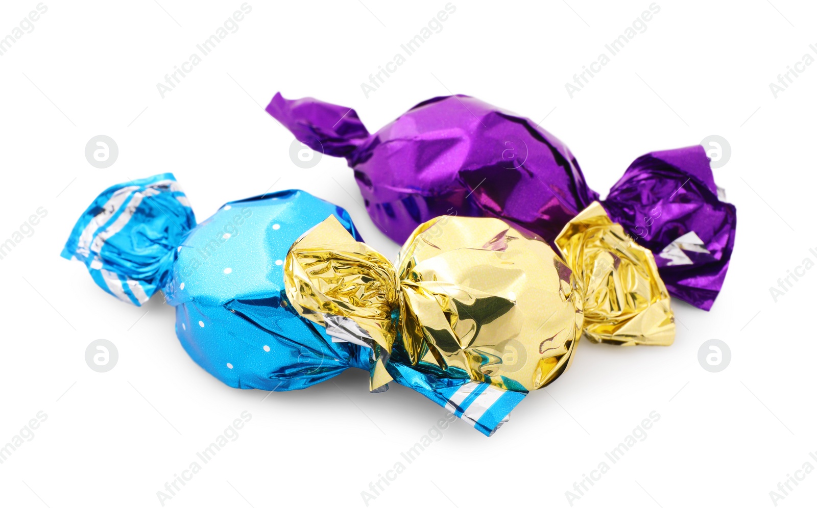 Photo of Sweet candies in colorful wrappers on white background