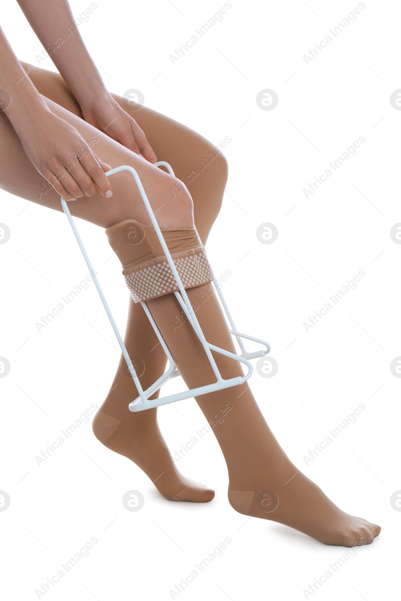 Photo of Woman wearing compression tights with donner on white background, closeup