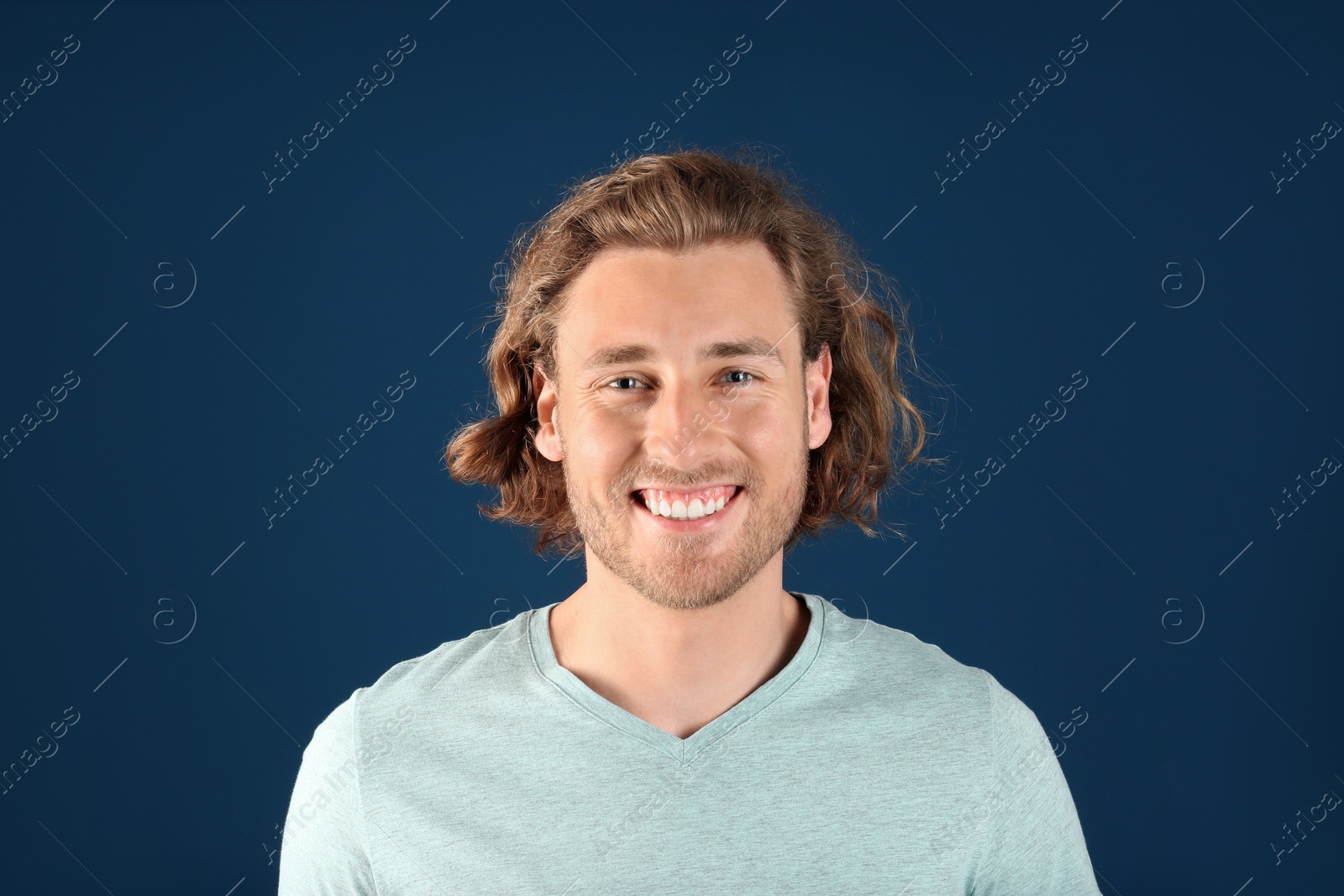 Photo of Portrait of handsome man on color background