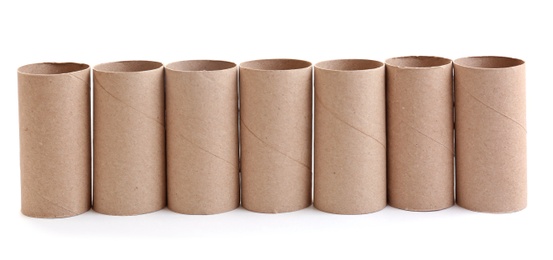 Photo of Row of empty paper toilet rolls on white background