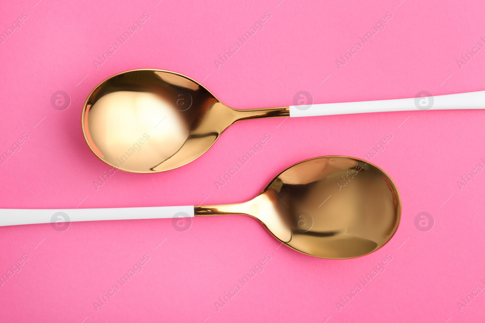 Photo of Clean tablespoons on color background, flat lay