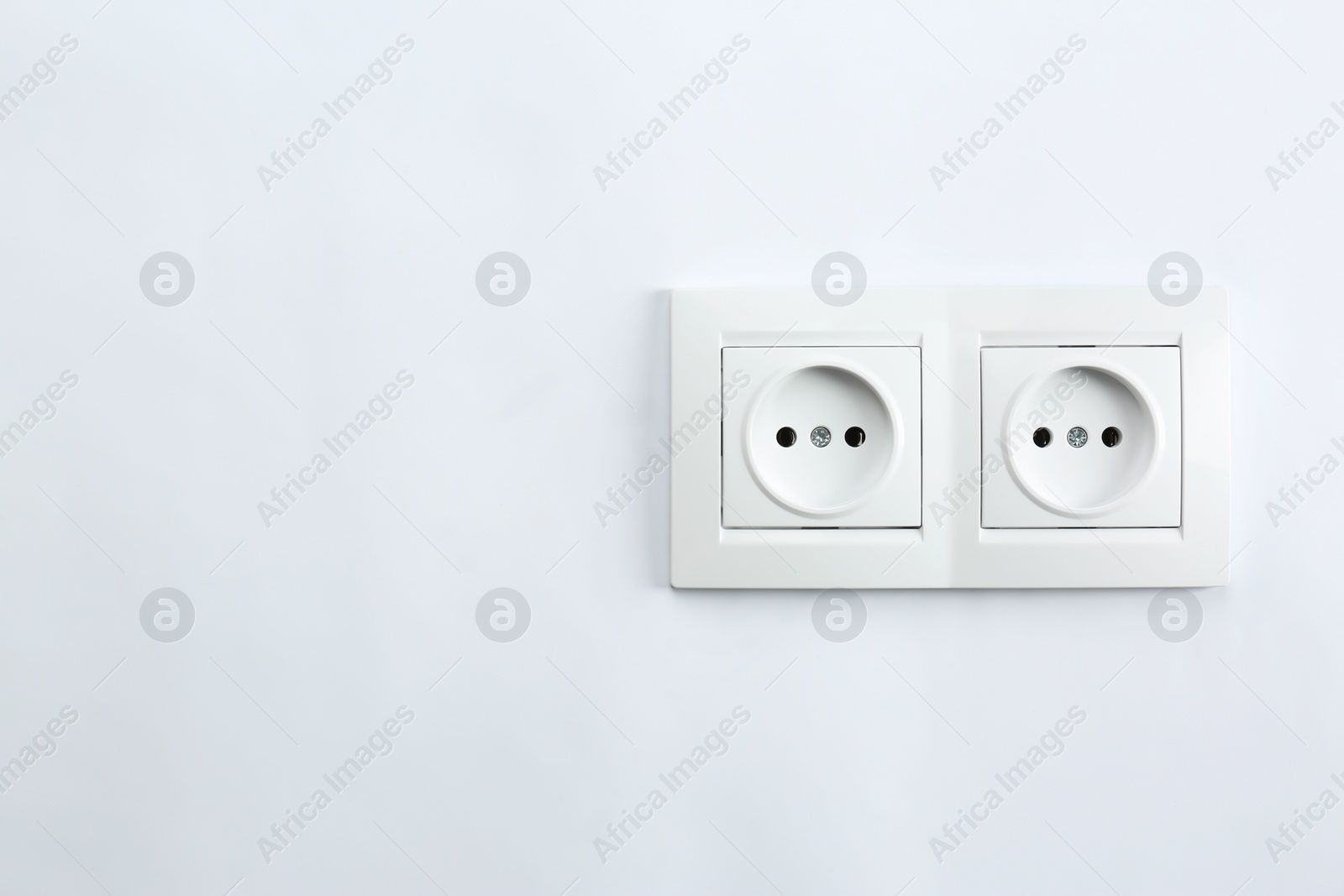 Photo of Power sockets on white background. Electrician's equipment