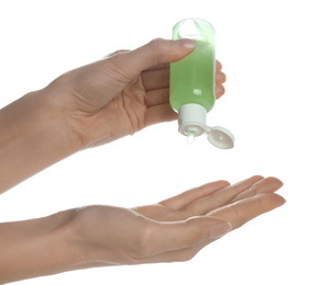 Woman applying antibacterial hand gel against white background, closeup