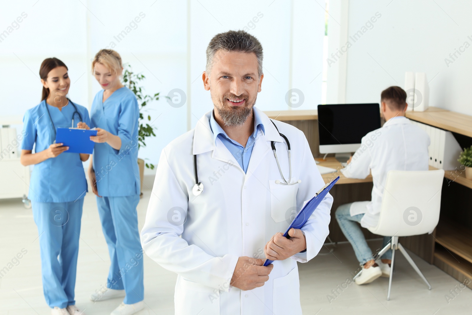 Photo of Doctor and medical assistants in clinic. Health care service