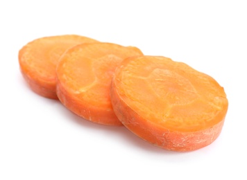 Photo of Slices of fresh ripe carrot on white background