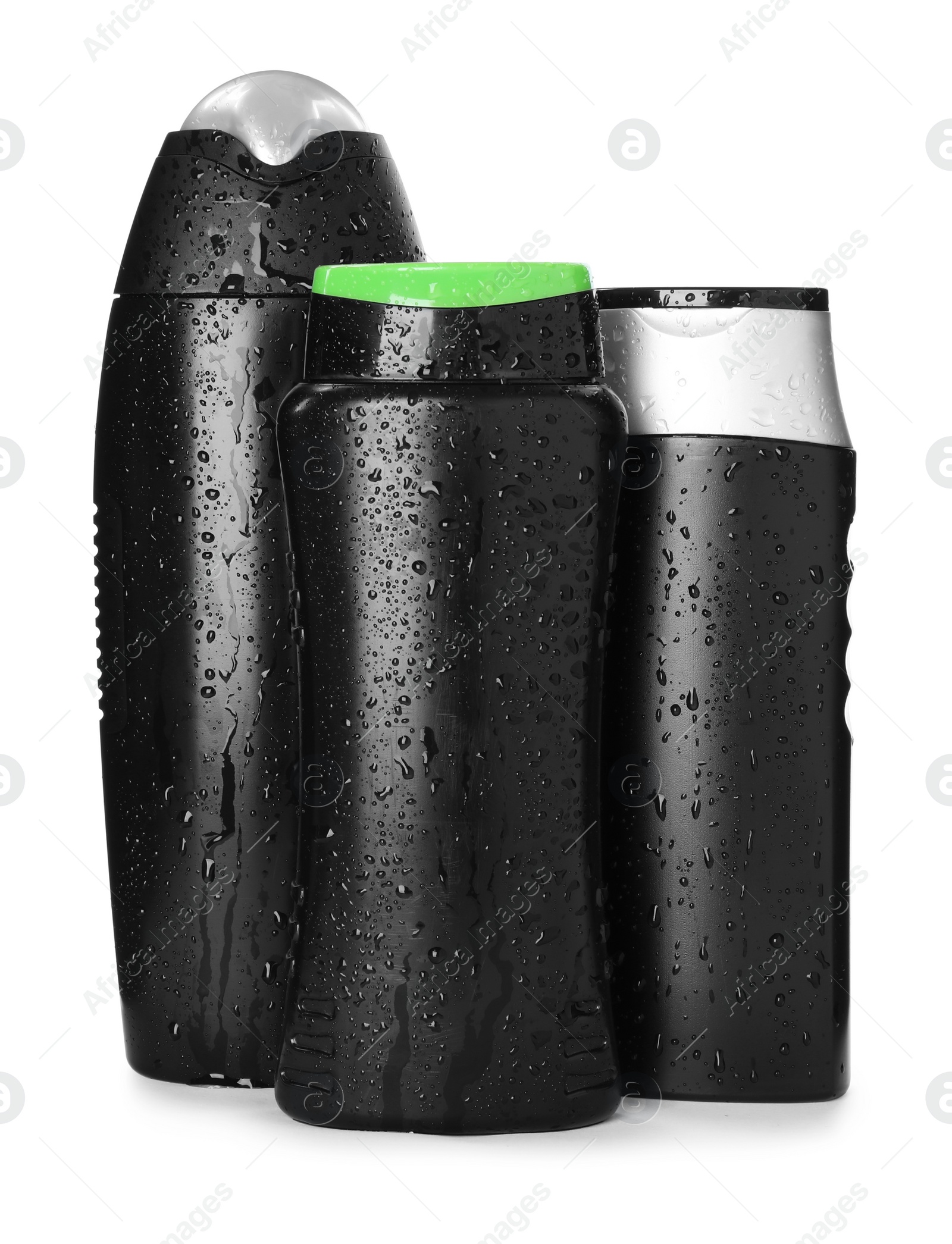 Photo of Black bottles covered with water drops isolated on white. Men's cosmetics