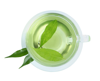 Cup of aromatic green tea and leaves isolated on white, top view