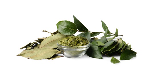 Photo of Fresh and ground bay leaves on white background