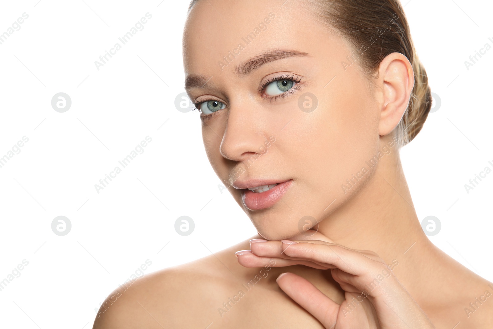 Photo of Portrait of young woman with foundation on her face against white background