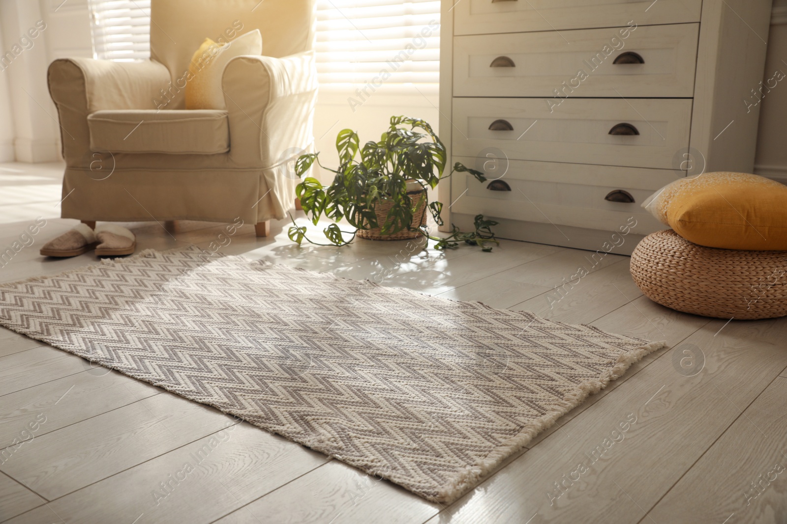 Photo of Modern room interior with stylish rug and furniture