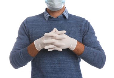 Man wearing protective face mask and medical gloves on white background, closeup