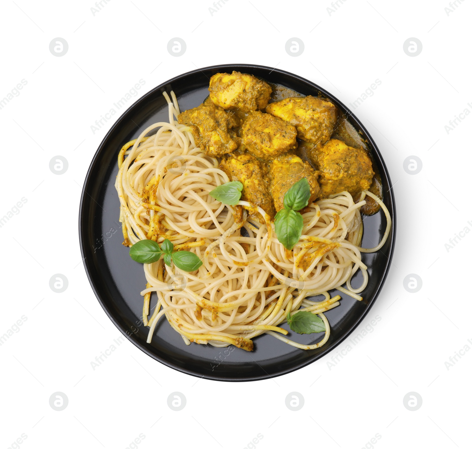 Photo of Delicious pasta and chicken with curry sauce isolated on white, top view