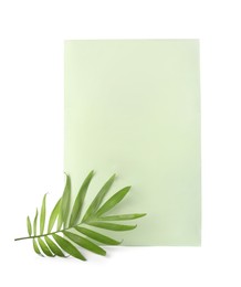 Photo of Scented sachet and green leaf on white background