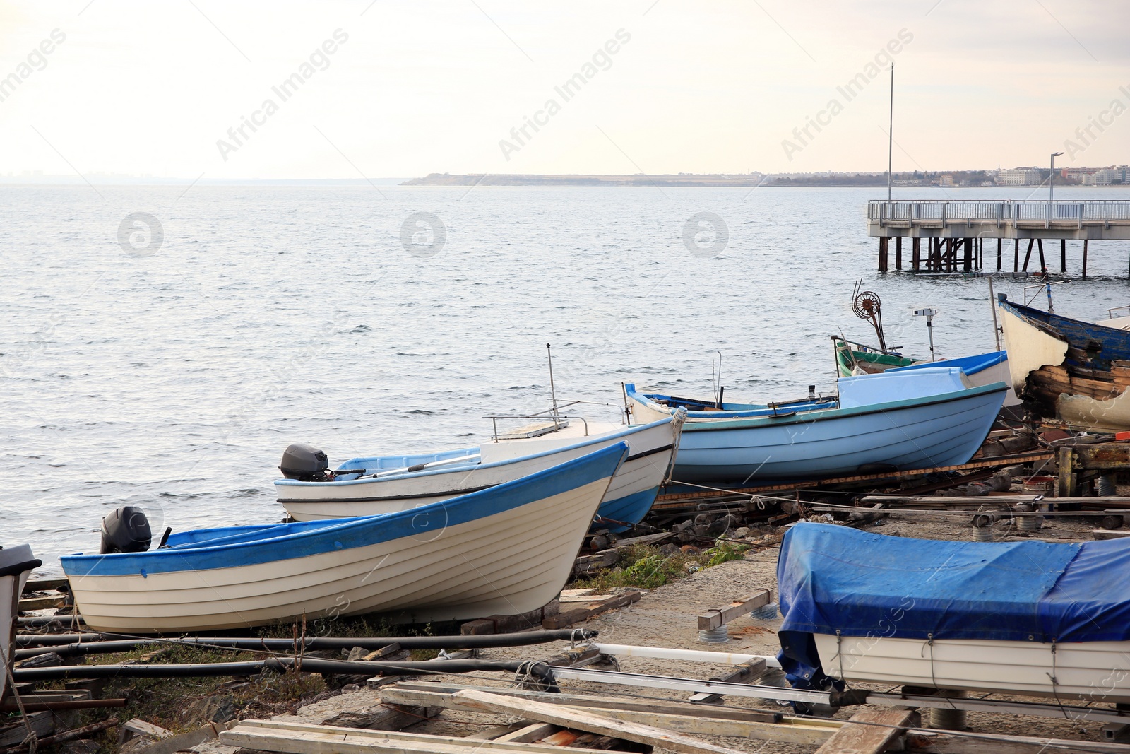 Photo of Moored boats on beach near sea outdoors