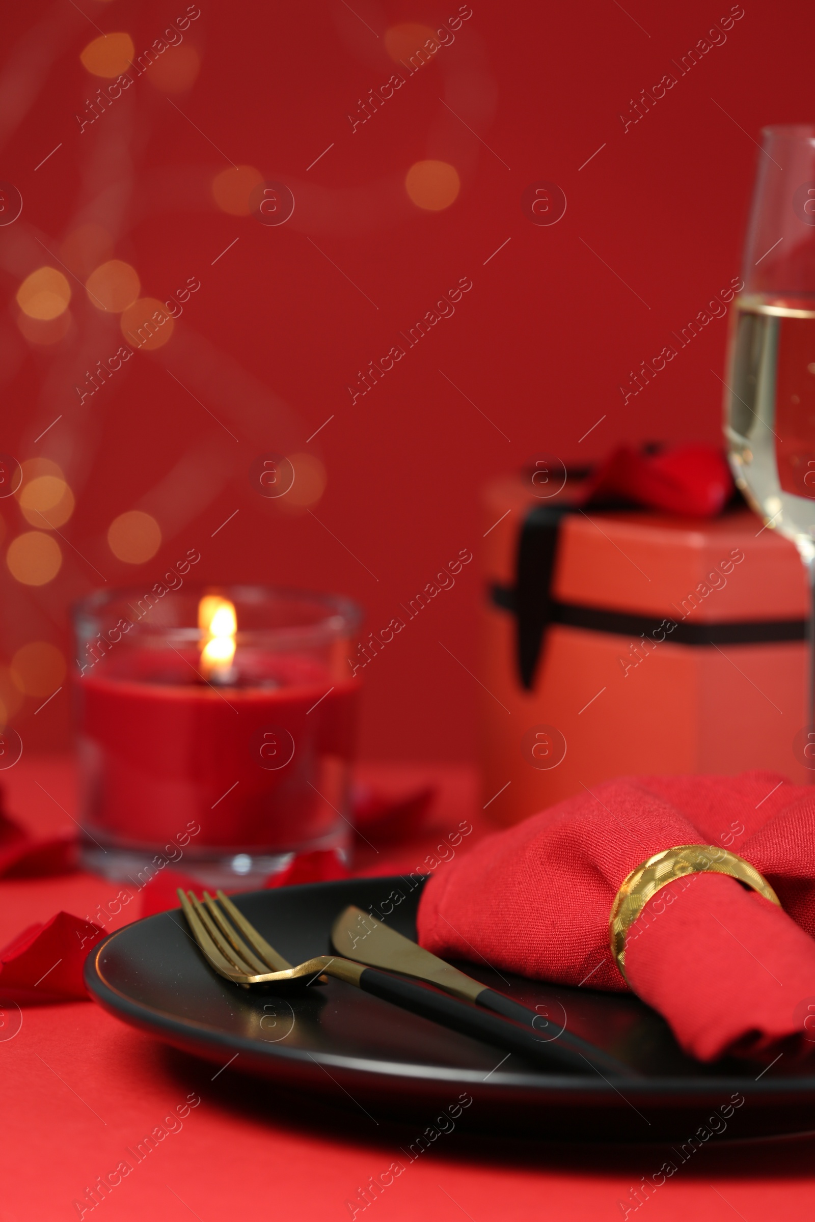 Photo of Beautiful table setting with burning candle for romantic dinner, closeup