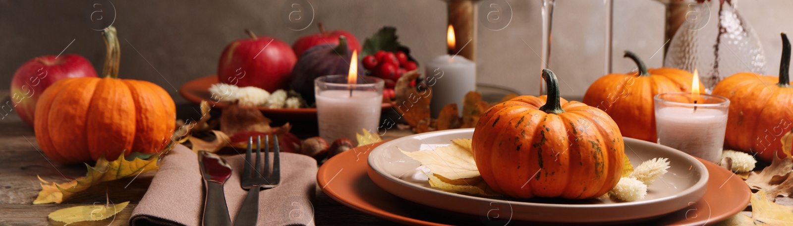 Image of Beautiful autumn place setting and decor on wooden table. Banner design