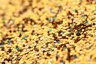 Many golden paillettes as background, closeup view