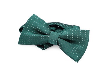 Photo of Stylish green bow tie with polka dot pattern on white background