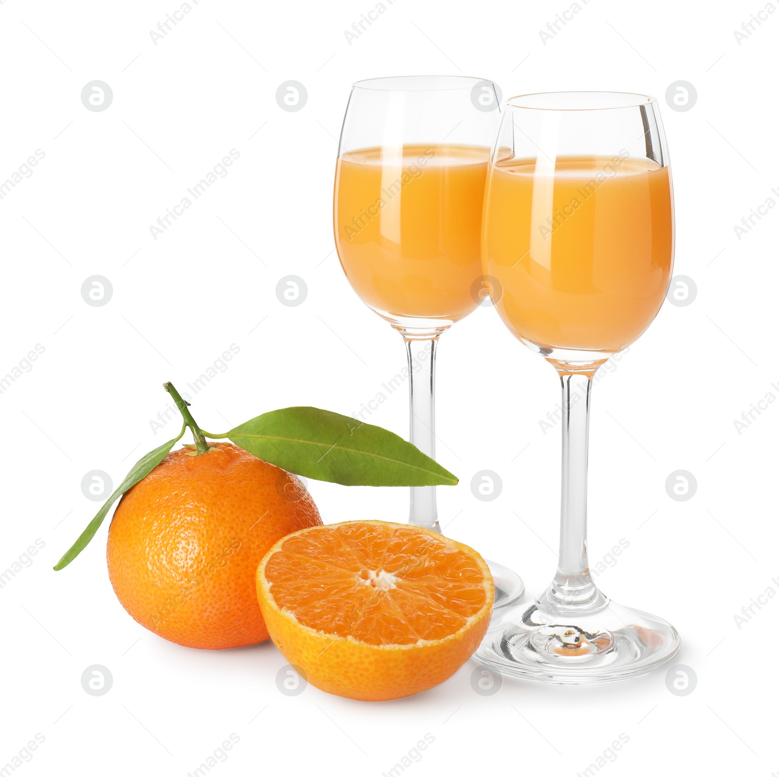 Photo of Tasty tangerine liqueur in glasses and fresh citrus fruits isolated on white