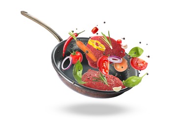 Tasty fresh ingredients and frying pan on white background