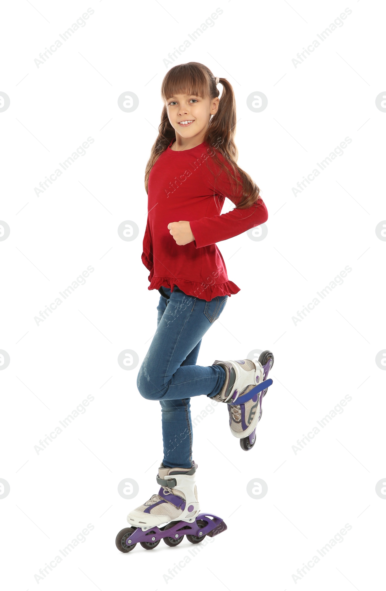 Photo of Little girl with inline roller skates on white background