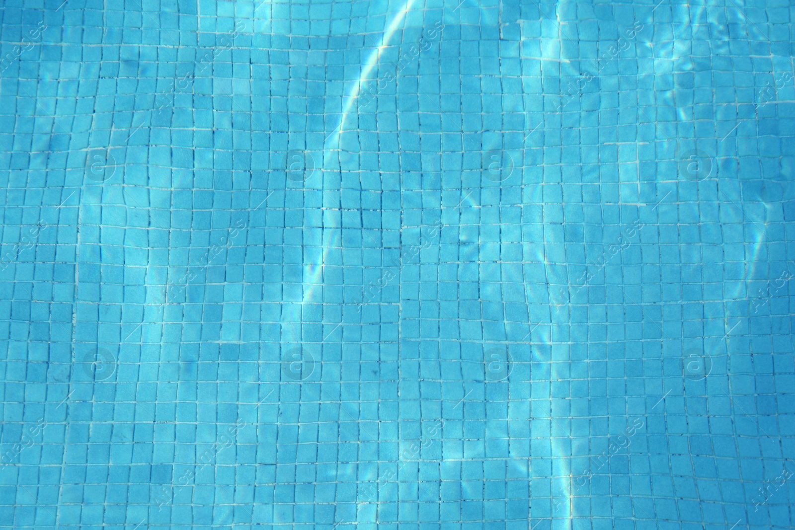 Photo of Empty swimming pool with clear water, top view