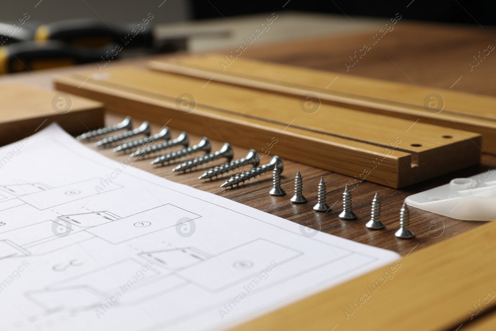 Photo of Composition with furniture parts and tools for self-assembly on wooden background, closeup