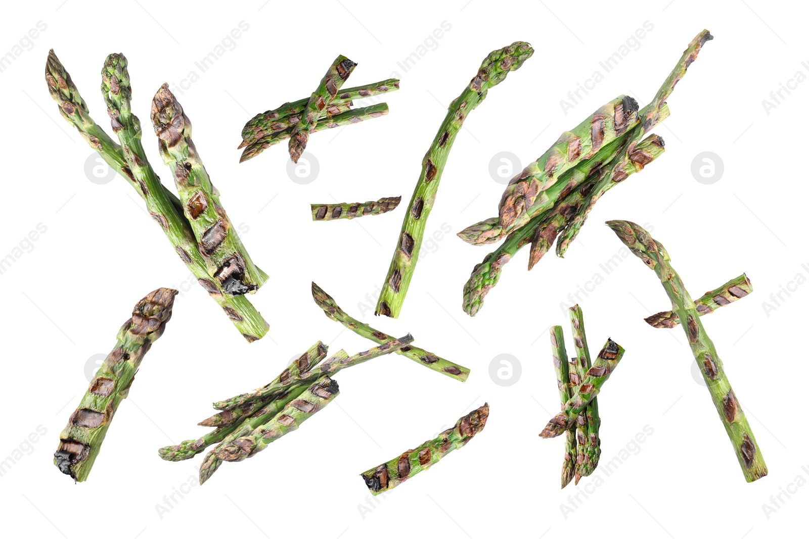 Image of Grilled asparagus spears in air on white background