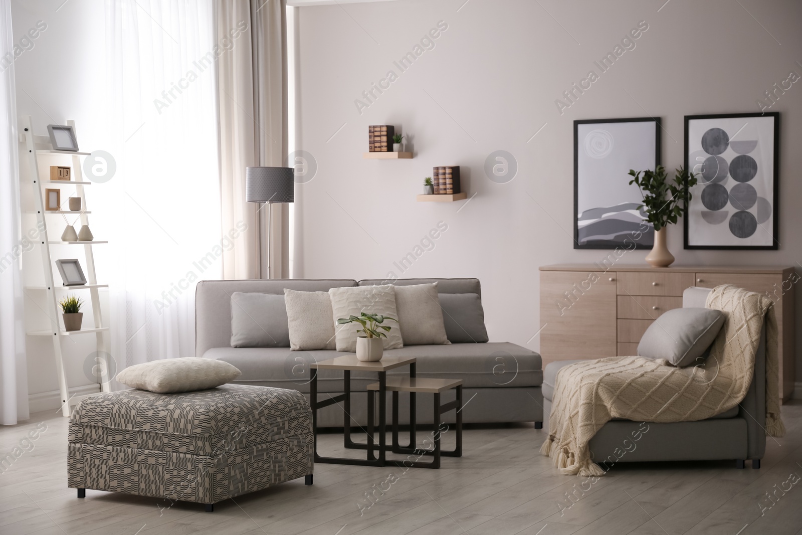 Photo of Modern living room interior with comfortable sofa near window