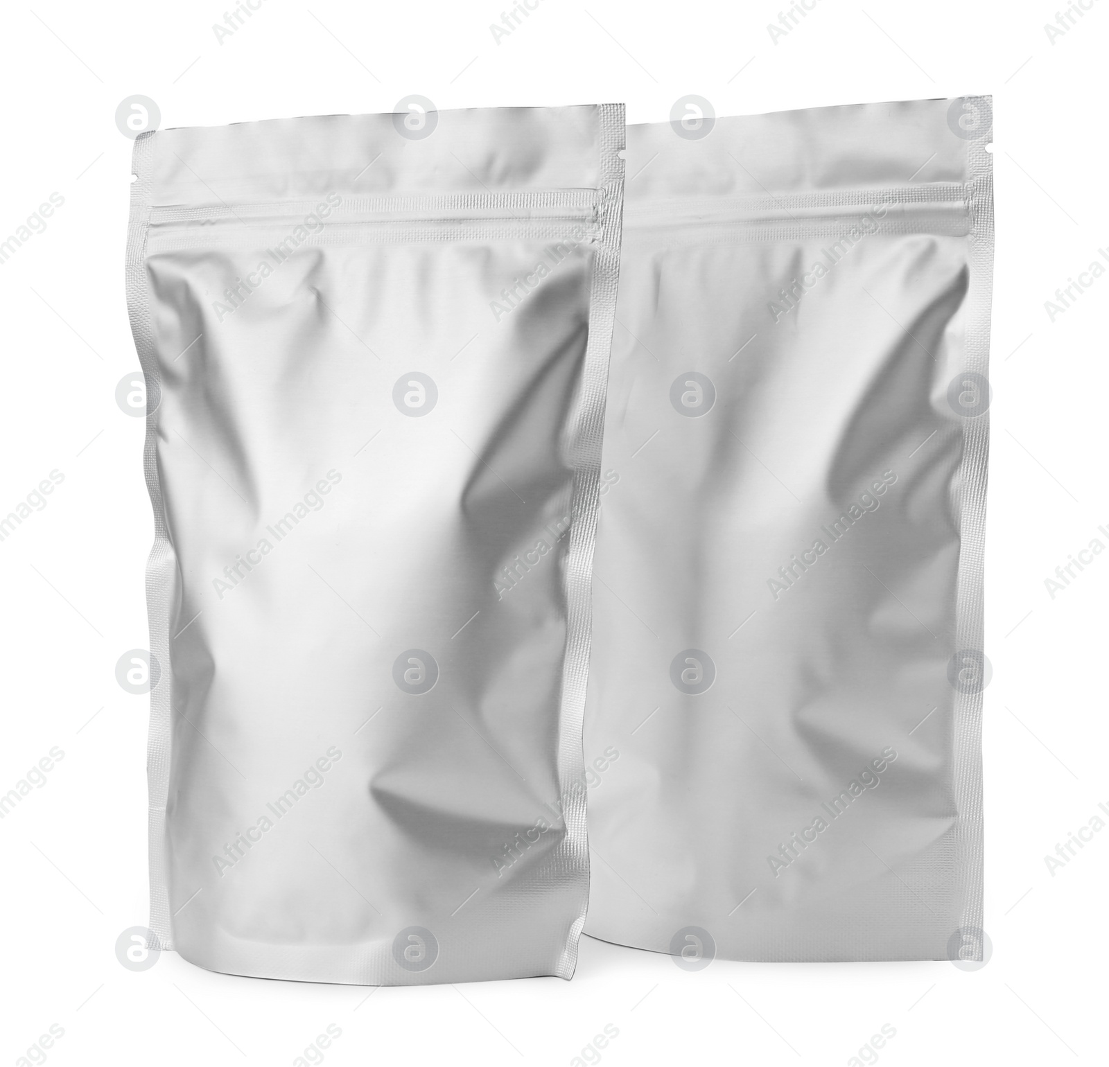 Photo of Two blank foil packages isolated on white