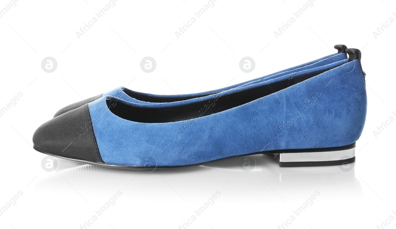 Photo of Pair of female shoes on white background