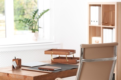 Photo of Wooden table with stationery in lawyer's office