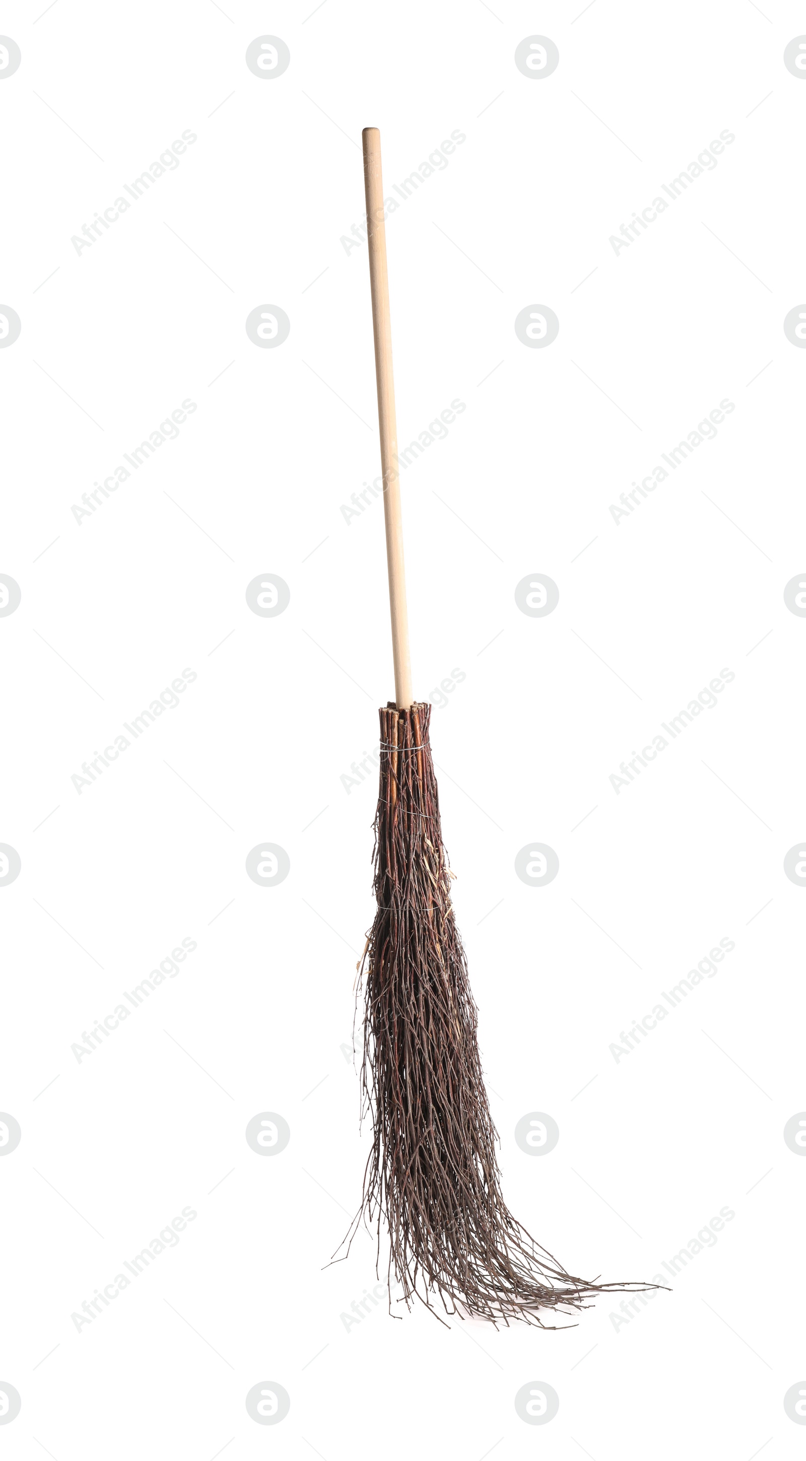 Photo of Old broom with wooden handle isolated on white