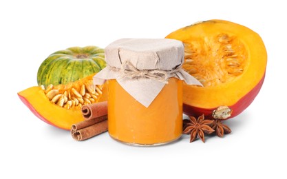 Photo of Jar of pumpkin jam, star anise, fresh pumpkins and cinnamon on white background