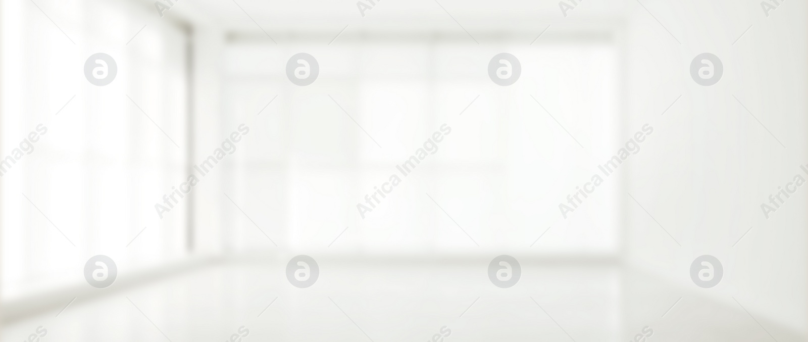 Image of Empty room with white wall and panoramic windows, blurred view. Banner design