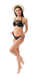 Photo of Beautiful young woman in black bikini with hat on white background