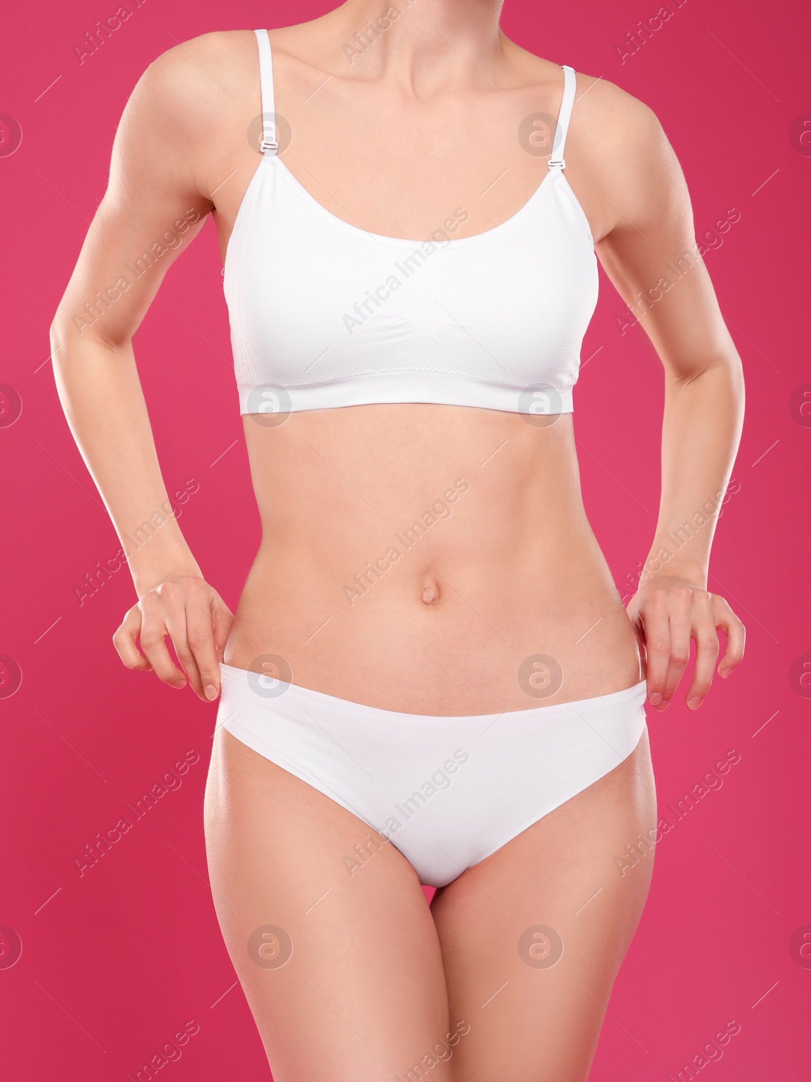 Photo of Slim young woman with smooth gentle skin on color background. Beauty and body care concept