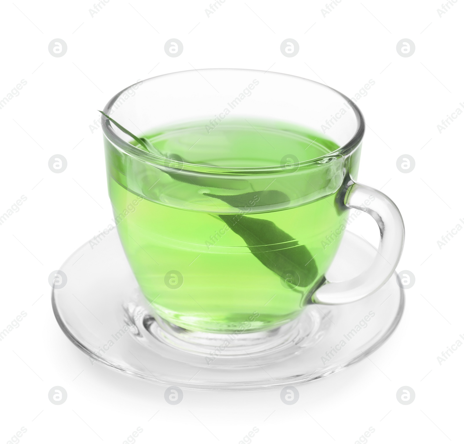 Photo of Fresh green tea in glass cup, leaves and saucer isolated on white