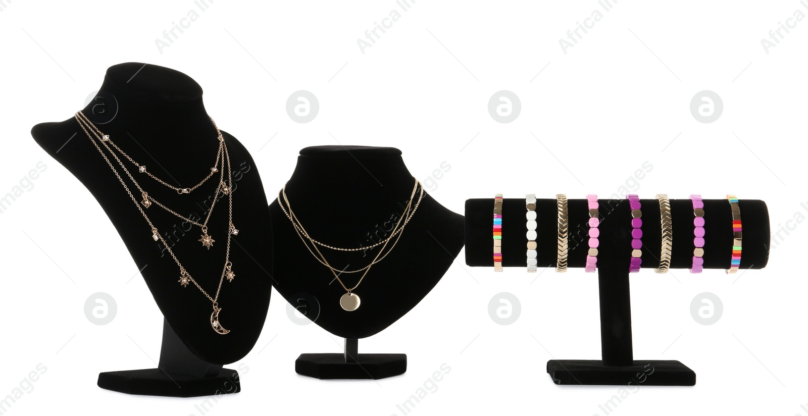 Photo of Different display stands with stylish jewelry on white background