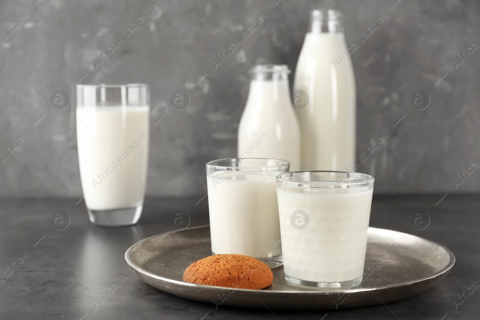 Photo of Glassware with milk on table. Fresh dairy product