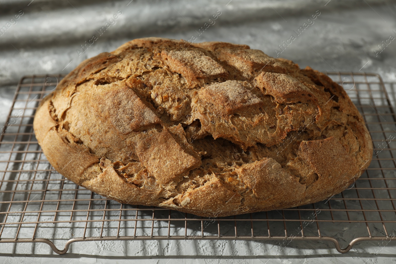 Photo of Freshly baked sourdough bread on grey table